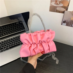 Chic pink pleated handbag with sparkling rhinestone handle and detachable silver chain strap
