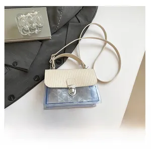 Mini transparent jelly crossbody bag with turn lock and pleated flap details