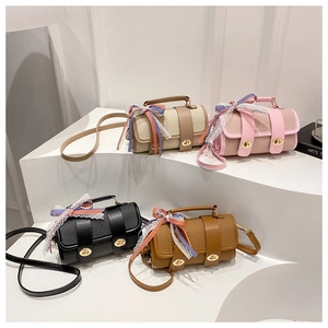 Cylindrical crossbody bags collection in beige, pink, black and brown with ribbon bows
