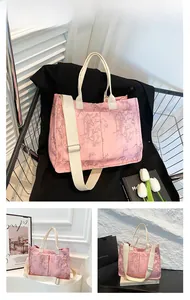 Detailed view of pink tote bag with bamboo patterns and wide adjustable shoulder strap