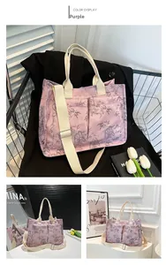 Detail of purple tote bag with bamboo leaf print and adjustable fabric shoulder strap