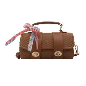 Sac à main cylindrique marron tissé avec lanières en cuir et nœud décoratif chic