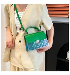 Detail of green leather flap and blue translucent jelly bag with silver clasp closure