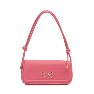 Elegant pink underarm bag with a golden bow buckle and knotted rope straps on white background