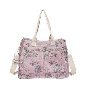 Pink tote bag with grey bamboo leaf print and adjustable white shoulder strap