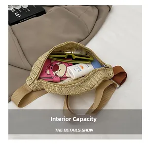 Spacious interior of woven straw crossbody bag showing storage for summer essentials
