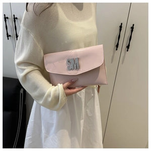 Pink envelope clutch bag with sparkling diamond SM logo and glossy faux leather finish