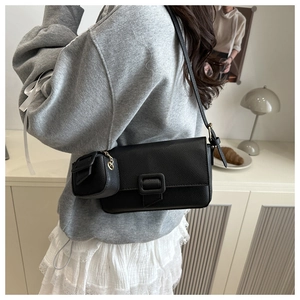 Litchi pattern leather baguette bag with a mini pouch charm and adjustable strap