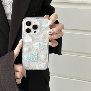 Sparkling ocean themed iPhone case with 3D shells, blue fish and glitter details