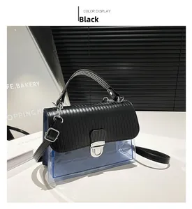 Detail of blue PVC crossbody bag with diamond quilting and silver metal clasp