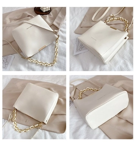 Detailed views of creamy white bucket bag featuring elegant gold chain and fashion lettering