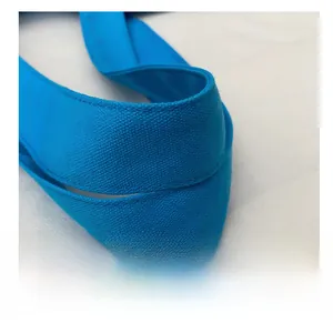Detailed macro view of the bright blue reinforced canvas strap with premium stitching
