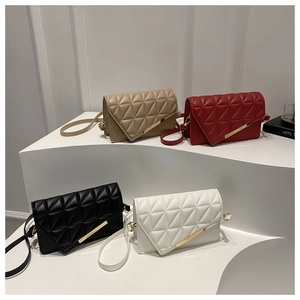 Detailed display of four quilted crossbody bags in khaki, red, black and white colors