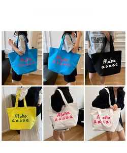 Collage of large canvas tote bags in blue, black, yellow and white shown from multiple angles