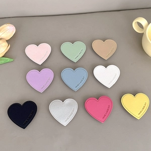 Colorful heart leather phone grips with Have a Nice Day embossing in ten vibrant colors