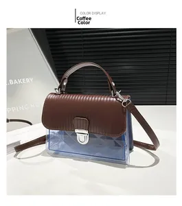 Detailed view of coffee brown leather and transparent blue PVC quilted crossbody bag