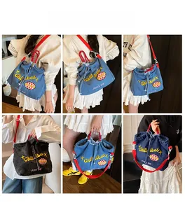 Detailed views of a denim tote bag with embroidered patches and red rope handles