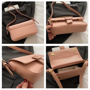 Detailed views of a pink pebble-grain baguette bag with gold hardware and interior space