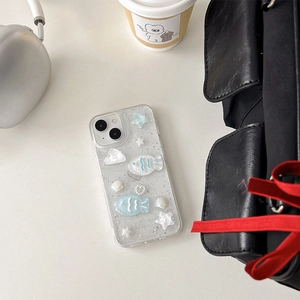 Close-up of glitter iPhone case with 3D resin ocean fish, shells and pearl charms