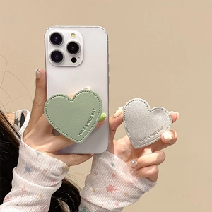 Detail of heart-shaped leather phone socket with Have a Nice Day embossing