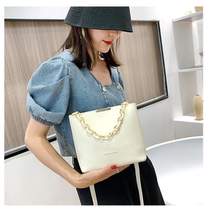 Chic cream white bucket bag with 'FASHION & BAGS' text and chunky decorative chain