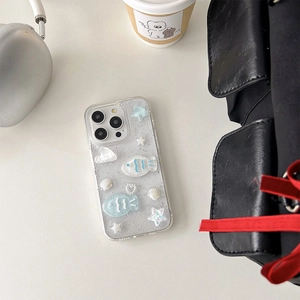 Detailed view of iPhone case with 3D ocean elements sea stars and glitter shell design