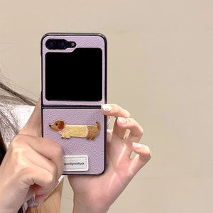 Detail of purple lychee leather phone case featuring embroidered dachshund for Z Flip series
