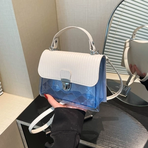 Transparent blue jelly crossbody bag with white flap and silver twist lock closure