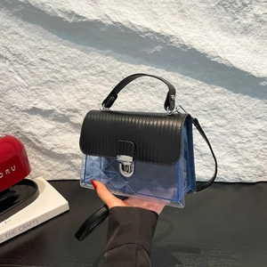 Blue transparent jelly crossbody bag with black leather flap and silver twist lock