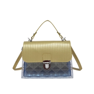 Transparent jelly crossbody bag with gold flap and blue inner pouch on white background