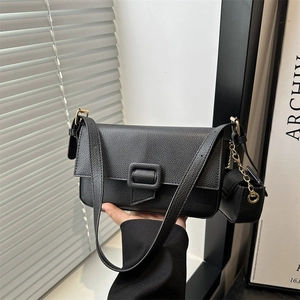 Minimalist black lychee texture leather handbag with shoulder strap and detachable pouch