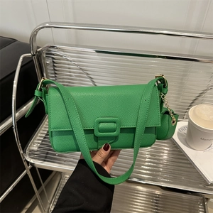 Vibrant green leather shoulder bag with lychee texture and round coin purse accessory