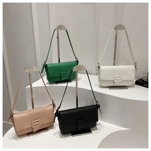 Four textured underarm bags in green, white, pink, and black on professional displays