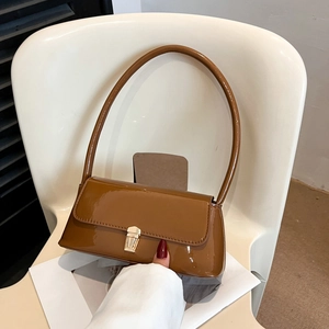 Vintage glossy caramel brown baguette underarm bag with gold metal buckle closure