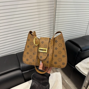 Vintage monogram shoulder bag in brown with star patterns and golden metal buckle clasp