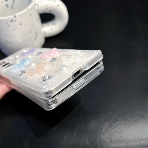 Close-up of precise cutouts on butterfly pearl rhinestone case for Z Flip foldable phone