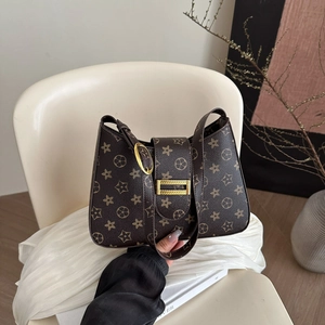 Vintage brown monogram underarm bag with gold buckles for daily commute and street style