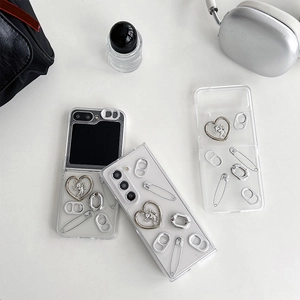 Detail of Y2K style case for Samsung Z Flip6 featuring 3D metal heart and clip charms