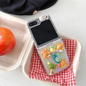 Detailed view of 3D resin bear and pineapple charms on a clear foldable phone case