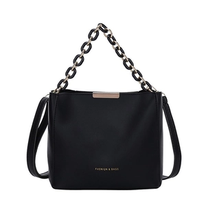 Minimalist black bucket bag for women with gold chain handle and matte leather finish