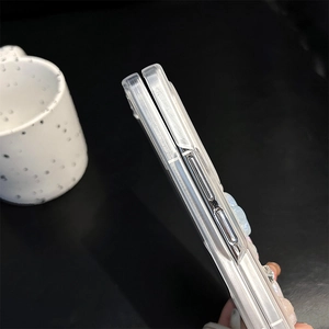 Detail view of pearlescent folding phone case showing precise side cutouts and thickness