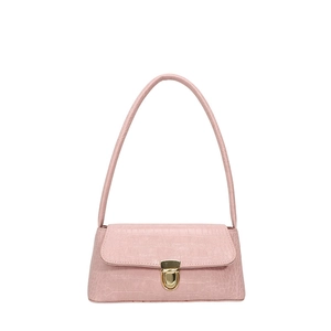 Pink crocodile embossed baguette bag with gold metal clasp on a clean white backdrop