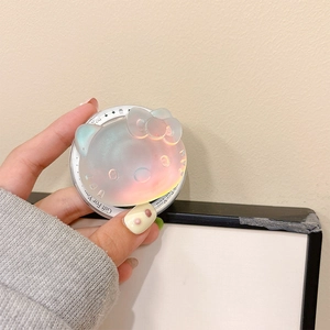 Detailed close-up of a holographic Hello Kitty resin phone grip with laser aurora finish