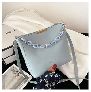Chic light blue leather bucket bag with gold chain strap and FASHION & BAGS lettering