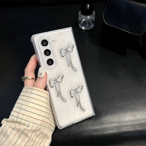 Close-up of glitter phone case with 3D silver bows for Samsung Galaxy Z Fold