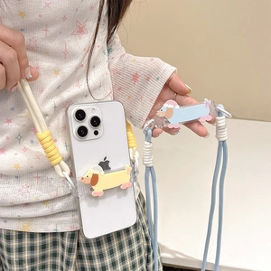 Detail of crossbody phone strap with cute cartoon dachshund charm on transparent case