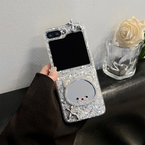 Detail of Samsung Z Flip 6 case with bear mirror, rhinestones, and silver balloon dog