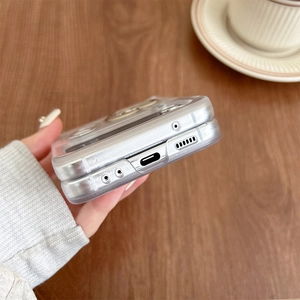 Close-up of precise cutouts for charging port and speaker on translucent silver phone case