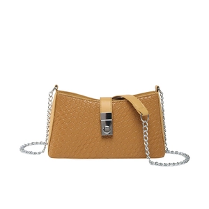 Brown crocodile embossed shoulder bag with silver chain strap and metal clasp on white background
