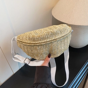 Handmade woven straw crossbody chest bag with white adjustable strap and fishbone pattern